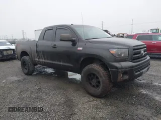 2012 Toyota Tundra 4WD Truck with VIN 5TFUY5F13CX212586, listed as a IAAI auction lot 41301700 with 167,412 mi miles. Bid and sale history available at carsss.com. Image 1.