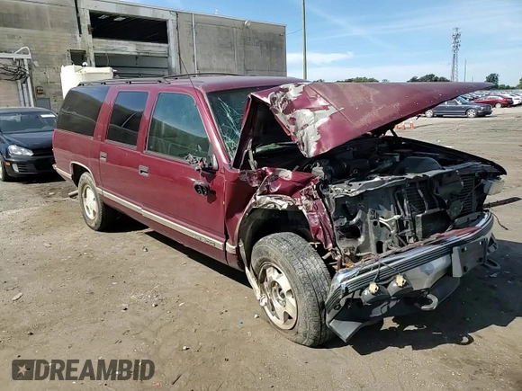 1998 GMC Suburban z VIN 3GKFK16R1WG503206, wystawiony jako Copart lot #69802344 z przebiegiem 231 148 mil mil oraz Szkody całkowita. Historia ofert i sprzedaży dostępna na DreamBid. Obrazek 11.