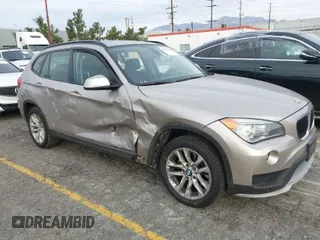 2015 BMW X1 xDrive28i with VIN WBAVL1C55FVY41749, listed as a IAAI auction lot 40977221 with 120,924 mi miles. Bid and sale history available at carsss.com. Image 1.