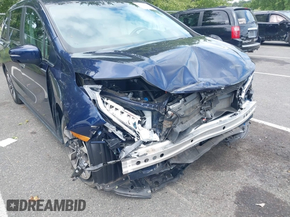 2022 Honda Odyssey EX-L with VIN 5FNRL6H70NB053843, listed as a IAAI auction lot 40210685 with 21,571 mi miles and . Bid and sale history available at DreamBid. Image 6.