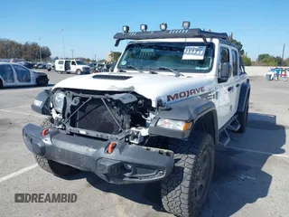2022 Jeep Gladiator Mojave z VIN 1C6JJTEG0NL103523, wystawiony jako IAAI lot #41842011 z przebiegiem 36 160 mil mil oraz . Historia ofert i sprzedaży dostępna na DreamBid. Obrazek 2.