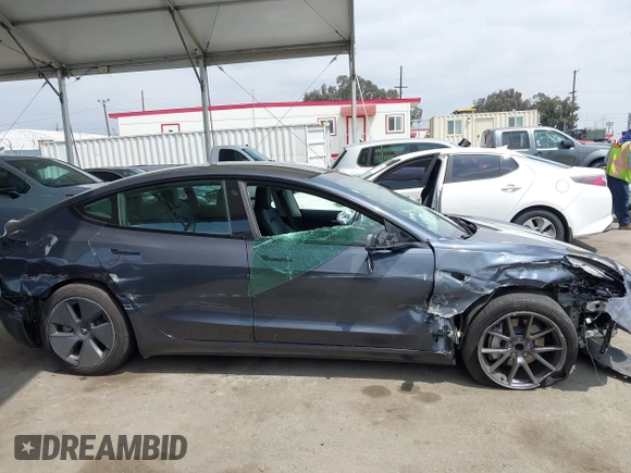 2023 Tesla Model 3 with VIN 5YJ3E1EA0PF518904, listed as a IAAI auction lot 42058540 with 20,945 mi miles and . Bid and sale history available at DreamBid. Image 12.