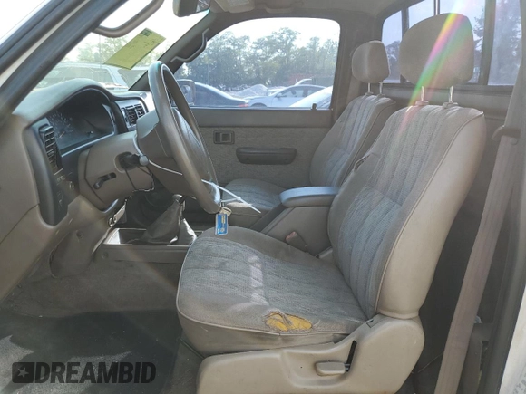 1999 Toyota Tacoma with VIN 4TAPM62N8XZ457624, listed as a Copart auction lot 71565904 with 133,851 mi miles and Salvage Title. Bid and sale history available at DreamBid. Image 7.
