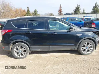 2016 Ford Escape Titanium with VIN 1FMCU9JX4GUB38303, listed as a IAAI auction lot 41788421 with 138,511 mi miles and . Bid and sale history available at DreamBid. Image 14.