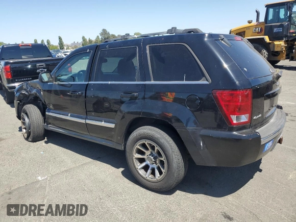 2005 Jeep Grand Cherokee Limited with VIN 1J8HR58265C699077, listed as a Copart auction lot 58490185 with 163,280 mi miles and Salvage title. Bid and sale history available at DreamBid. Image 2.