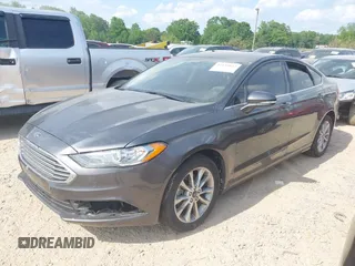 2017 Ford Fusion SE z VIN 3FA6P0H71HR410878, wystawiony jako IAAI lot #42135622 z przebiegiem 99 462 mil mil oraz . Historia ofert i sprzedaży dostępna na DreamBid. Obrazek 2.