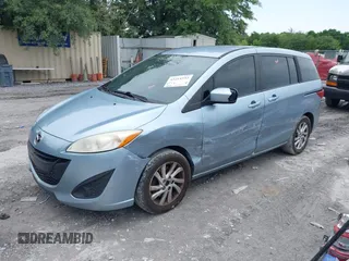 2012 Mazda 5 Sport with VIN JM1CW2BL4C0130446, listed as a IAAI auction lot 42215533 with 238,221 mi miles and . Bid and sale history available at DreamBid. Image 2.