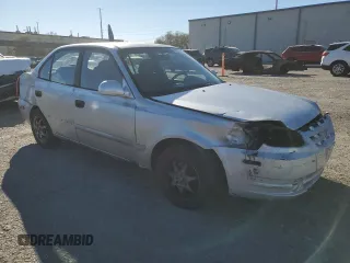 2003 Hyundai Accent GL z VIN KMHCG45C63U413388, wystawiony jako Copart lot #88979235 z przebiegiem 240 928 mil mil oraz Szkoda całkowita • Salvage title. Historia ofert i sprzedaży dostępna na DreamBid. Obrazek 4.