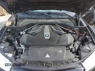 2014 BMW X5 xDrive50i z VIN 5UXKR6C57E0C03016, wystawiony jako Copart lot #50720775 z przebiegiem 131 958 mil mil oraz Czysty tytuł • Clean title. Historia ofert i sprzedaży dostępna na DreamBid. Obrazek 11.