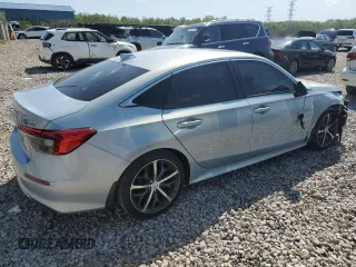 2023 Honda Civic Touring z VIN 2HGFE1F94PH310134, wystawiony jako Copart lot #52311085 z przebiegiem 32 682 mil mil oraz Szkoda całkowita • Salvage title. Historia ofert i sprzedaży dostępna na DreamBid. Obrazek 3.