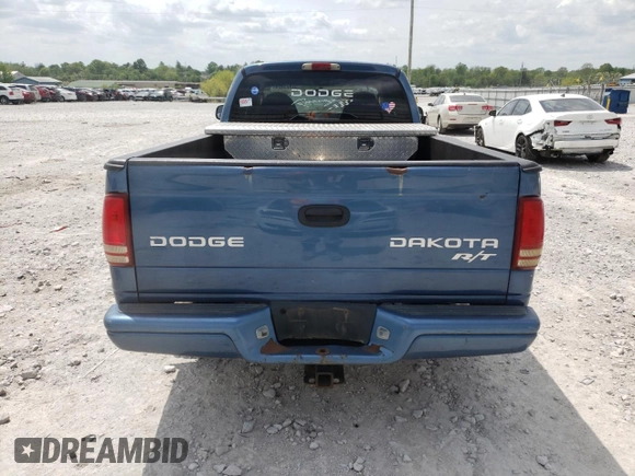 2003 Dodge Dakota с VIN 1D7GL72Z63S140501, выставлен на аукционе Copart как лот 52825824 с пробегом 188 913 миль миль и Списание • Salvage title. История ставок и продаж доступна на DreamBid. Изображение 6.