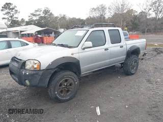 2001 Nissan Frontier SE z VIN 1N6ED27T91C318489, wystawiony jako IAAI lot #41441798 z przebiegiem 214 834 mil mil oraz . Historia ofert i sprzedaży dostępna na DreamBid. Obrazek 2.