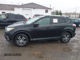 2018 Toyota RAV4 LE with VIN 2T3BFREV2JW788700, listed as a IAAI auction lot 41986212 with 87,704 mi miles. Bid and sale history available at carsss.com. Image 13.