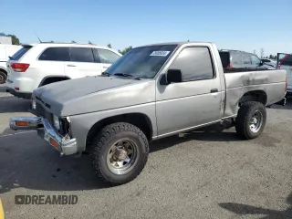 1987 Nissan Hardbody E z VIN JN6ND11SXHW014073, wystawiony jako Copart lot #78956934 z przebiegiem 381 885 mil mil oraz Szkody całkowita. Historia ofert i sprzedaży dostępna na DreamBid. Obrazek 1.