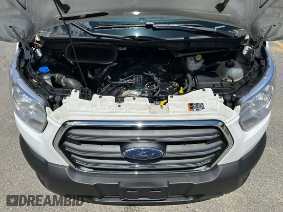 2020 Ford Transit Cargo z VIN 1FTBR1CG3LKB36452, wystawiony jako Copart lot #58659545 z przebiegiem 171 504 mil mil oraz Tytuł czysty. Historia ofert i sprzedaży dostępna na DreamBid. Obrazek 5.