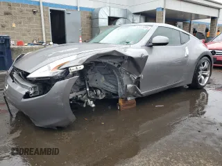 2009 Nissan 370Z Touring with VIN JN1AZ44E69M404789, listed as a Copart auction lot 62015094 with 56,447 mi miles and Salvage Title. Bid and sale history available at carsss.com. Image 1.