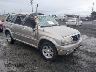 2001 Suzuki XL7 Standard z VIN JS3TX92VX14114699, wystawiony jako IAAI lot #41085552 z przebiegiem 195 316 mil mil oraz . Historia ofert i sprzedaży dostępna na DreamBid. Obrazek 1.
