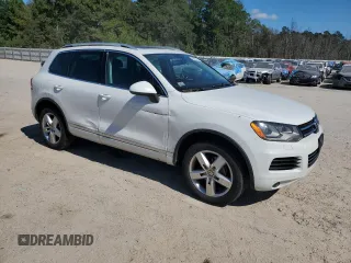 2014 Volkswagen Touareg Lux z VIN WVGEF9BP4ED011436, wystawiony jako Copart lot #74207144 z przebiegiem 207 059 mil mil oraz Szkoda całkowita • Salvage title. Historia ofert i sprzedaży dostępna na DreamBid. Obrazek 4.