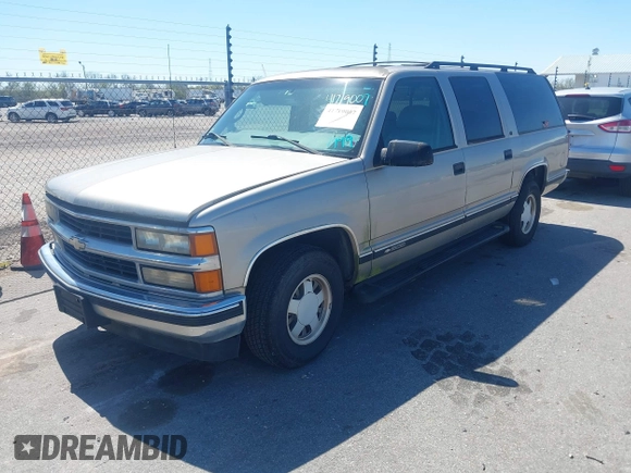 1999 Chevrolet Suburban with VIN 3GNEC16R9XG253081, listed as a IAAI auction lot 41719007 with 196,884 mi miles. Bid and sale history available at carsss.com. Image 2.