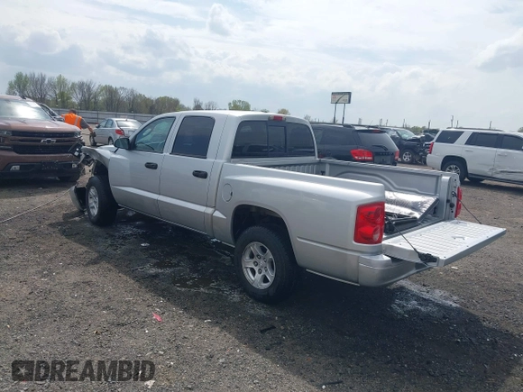 2007 Dodge Dakota SLT with VIN 1D7HE48KX7S122712, listed as a IAAI auction lot 41888864 with 114,384 mi miles and . Bid and sale history available at carsss.com. Image 3.