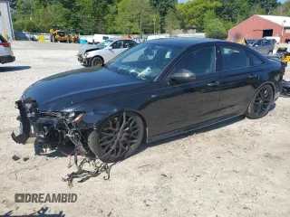 2016 Audi S6 Premium Plus z VIN WAUF2AFC2GN066099, wystawiony jako Copart lot #56342625 z przebiegiem 100 787 mil mil oraz Szkody całkowita. Historia ofert i sprzedaży dostępna na DreamBid. Obrazek 1.