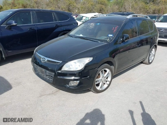 2012 Hyundai Elantra Touring SE with VIN KMHDC8AEXCU139403, listed as a IAAI auction lot 41862954 with 116,661 mi miles. Bid and sale history available at carsss.com. Image 2.