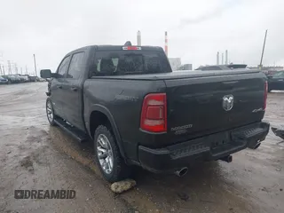 2021 Ram 1500 Laramie with VIN 1C6SRFJT6MN580803, listed as a IAAI auction lot 41207914 with 56,891 mi miles and . Bid and sale history available at DreamBid. Image 3.