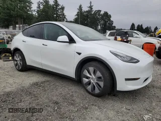 2023 Tesla Model Y Long Range z VIN 7SAYGDEE9PA081604, wystawiony jako Copart lot #60163785 z przebiegiem 42 134 mil mil oraz Szkoda całkowita • Salvage title. Historia ofert i sprzedaży dostępna na DreamBid. Obrazek 4.