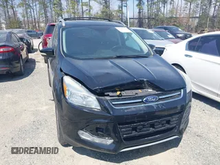 2016 Ford Escape Titanium with VIN 1FMCU0JX8GUC06601, listed as a IAAI auction lot 41785774 with 121,427 mi miles. Bid and sale history available at carsss.com. Image 6.