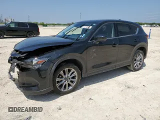 2021 Mazda CX-5 Grand Touring with VIN JM3KFADM5M0479247, listed as a Copart auction lot 51219915 with 33,384 mi miles and Salvage Title. Bid and sale history available at carsss.com. Image 1.