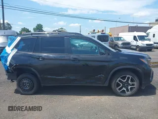 2023 Honda Passport Elite with VIN 5FNYF8H01PB030270, listed as a IAAI auction lot 42667744 with 7,931 mi miles and . Bid and sale history available at DreamBid. Image 13.