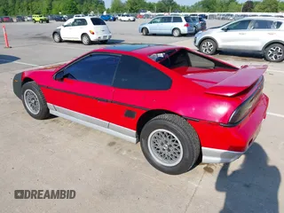 1986 Pontiac Fiero z VIN 1G2PG9791GP267415, wystawiony jako IAAI lot #42461769 z przebiegiem Nie podano mil oraz . Historia ofert i sprzedaży dostępna na DreamBid. Obrazek 3.