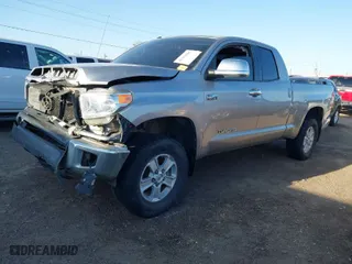 2014 Toyota Tundra 4WD Truck SR with VIN 5TFUW5F19EX330781, listed as a IAAI auction lot 41754261 with 168,388 mi miles. Bid and sale history available at carsss.com. Image 2.