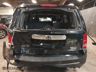 2011 Honda Pilot Touring with VIN 5FNYF4H97BB099528, listed as a IAAI auction lot 41721800 with 132,979 mi miles. Bid and sale history available at carsss.com. Image 16.