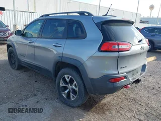 2015 Jeep Cherokee Trailhawk with VIN 1C4PJMBS3FW662307, listed as a IAAI auction lot 41778932 with 64,569 mi miles. Bid and sale history available at carsss.com. Image 3.