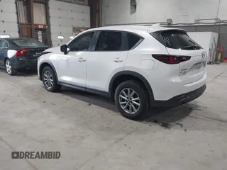2023 Mazda CX-5 2.5 S with VIN JM3KFBAMXP0153362, listed as a IAAI auction lot 41875188 with 57,648 mi miles. Bid and sale history available at carsss.com. Image 3.
