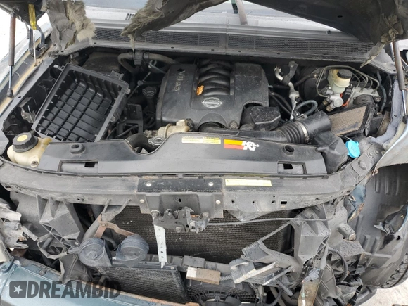 2006 Nissan Titan LE z VIN 1N6BA07B16N557411, wystawiony jako Copart lot #86058634 z przebiegiem 263 198 mil mil oraz Szkody całkowita. Historia ofert i sprzedaży dostępna na DreamBid. Obrazek 11.