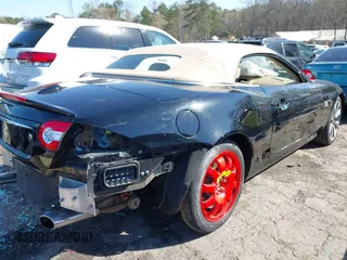 2014 Jaguar XK with VIN SAJWA4GB0ELB52358, listed as a IAAI auction lot 41832850 with 93,037 mi miles. Bid and sale history available at carsss.com. Image 6.