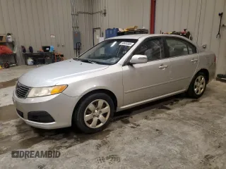 2009 Kia Optima LX z VIN KNAGE228095318860, wystawiony jako Copart lot #58665085 z przebiegiem 165 230 mil mil oraz Czysty tytuł • Clean title. Historia ofert i sprzedaży dostępna na DreamBid. Obrazek 1.