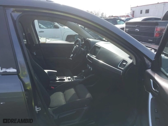 2016 Mazda CX-5 Touring with VIN JM3KE2CY6G0910986, listed as a IAAI auction lot 41619401 with NaN miles. Bid and sale history available at carsss.com. Image 5.