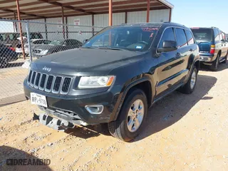 2014 Jeep Grand Cherokee Laredo with VIN 1C4RJEAG1EC348070, listed as a IAAI auction lot 41950898 with 129,883 mi miles. Bid and sale history available at carsss.com. Image 2.