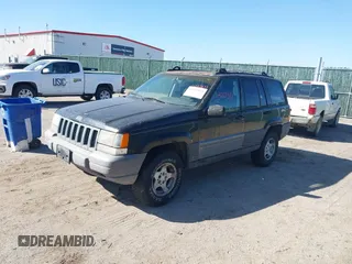 1997 Jeep Grand Cherokee Laredo with VIN 1J4GZ58S4VC633205, listed as a IAAI auction lot 41727571 with 201,228 mi miles. Bid and sale history available at carsss.com. Image 2.