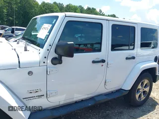 2018 Jeep Wrangler Unlimited Sahara with VIN 1C4BJWEG3JL805263, listed as a IAAI auction lot 42593276 with 96,489 mi miles and . Bid and sale history available at DreamBid. Image 14.