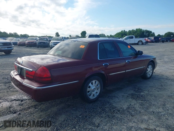 2004 Mercury Grand Marquis LS Premium z VIN 2MEFM75WX4X671041, wystawiony jako IAAI lot #42261517 z przebiegiem 107 182 mil mil oraz . Historia ofert i sprzedaży dostępna na DreamBid. Obrazek 4.