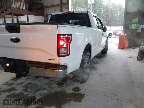 2015 Ford F-150 XL with VIN 1FTEX1C84FKF19753, listed as a IAAI auction lot 41561147 with 170,675 mi miles. Bid and sale history available at carsss.com. Image 4.