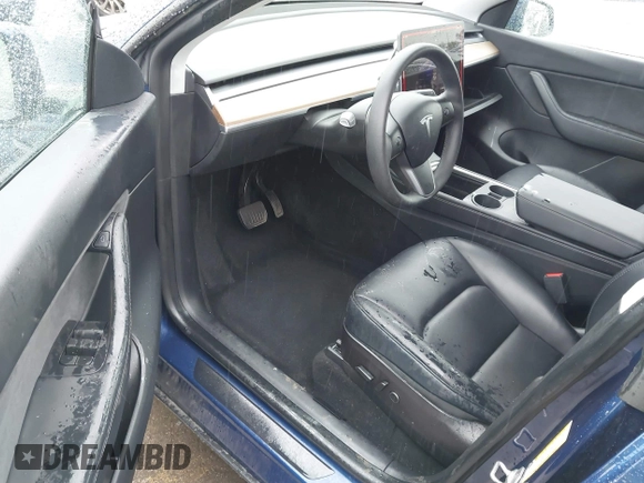 2022 Tesla Model Y Long Range with VIN 7SAYGDEE8NF511395, listed as a IAAI auction lot 41595310 with 65,156 mi miles and . Bid and sale history available at DreamBid. Image 5.