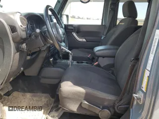 2014 Jeep Wrangler Unlimited Sahara with VIN 1C4BJWEG7EL228307, listed as a Copart auction lot 58663455 with 188,024 mi miles and Salvage title. Bid and sale history available at DreamBid. Image 7.