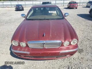2005 Jaguar XJ Vanden Plas z VIN SAJWA82C75SG33074, wystawiony jako Copart lot #48725755 z przebiegiem 129 817 mil mil oraz Czysty tytuł • Clean title. Historia ofert i sprzedaży dostępna na DreamBid. Obrazek 5.