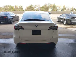 2023 Tesla Model Y Long Range with VIN 7SAYGAEE0PF787216, listed as a IAAI auction lot 41589954 with 17,985 mi miles and . Bid and sale history available at DreamBid. Image 17.