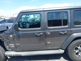 2020 Jeep Wrangler Unlimited Freedom z VIN 1C4HJXDG8LW338702, wystawiony jako IAAI lot #42006692 z przebiegiem 48 389 mil mil oraz . Historia ofert i sprzedaży dostępna na DreamBid. Obrazek 14.